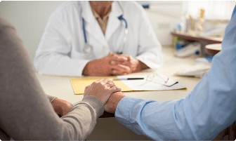 Doctor talking with a couple