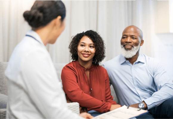 Doctor consulting a couple